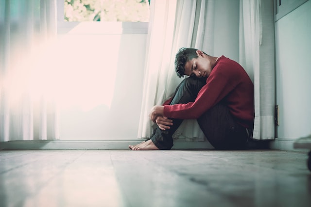 Boy sitting on the floor Boy sitting on the floor