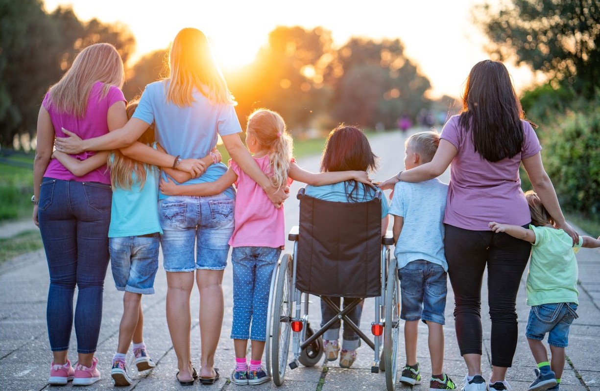women and children walking to support disability pride